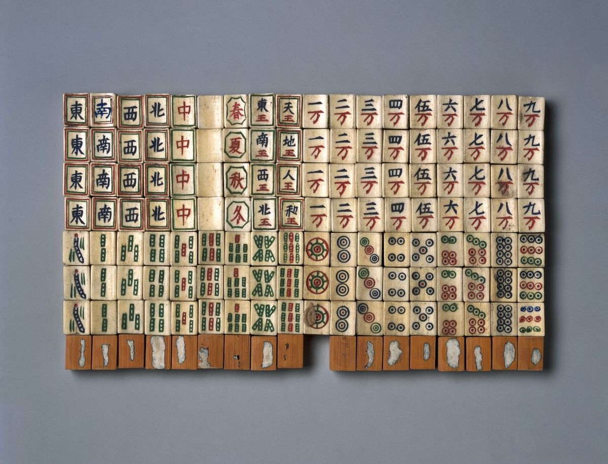 Antique bone-and-bamboo mahjong tiles from the 19th century, early evidence in the history of mahjong