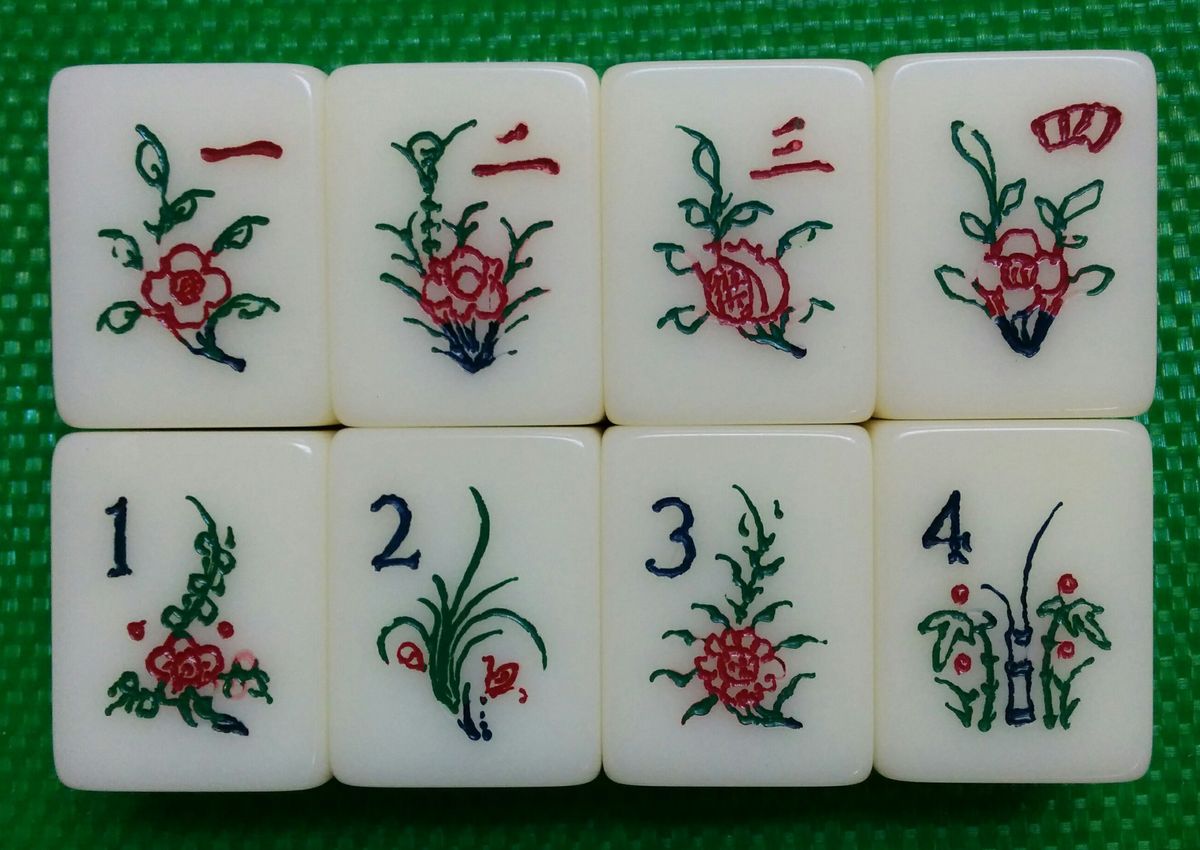The eight flower and season tiles that add tai in Malaysian mahjong scoring